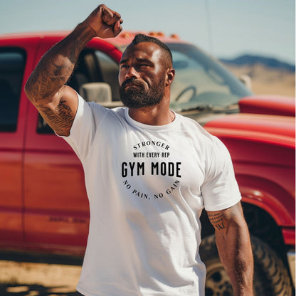 A person wearing a classic white T-shirt with the bold black text “Stronger With Every Rep – Gym Mode – No Pain, No Gain.” The fitness-themed design features a curved text layout, perfect for workout enthusiasts and gym-goers who embrace strength training and motivation.