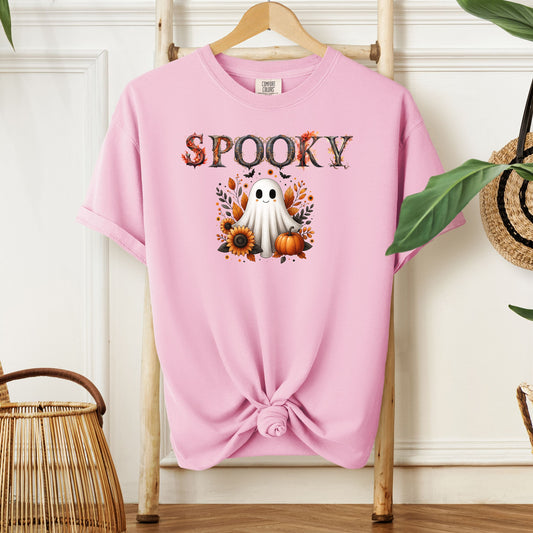 Blossom pink T-shirt featuring a cute "Spooky" Halloween design with a smiling ghost surrounded by pumpkins, sunflowers, and autumn leaves. The word "Spooky" is styled with rustic wood-textured letters accented with fall foliage. Perfect for festive fall outfits, Halloween parties, or cozy seasonal wear.