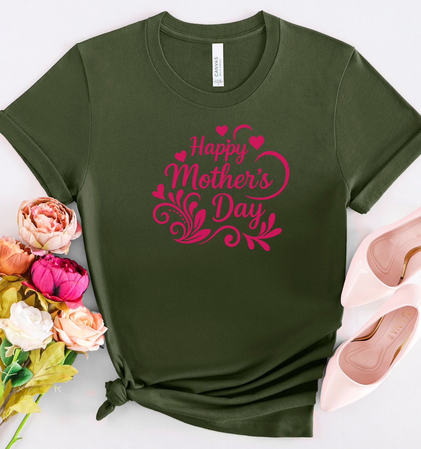 Military Green t-shirt with 'Happy Mother's Day' in pink text, surrounded by flowers and shoes on a white background