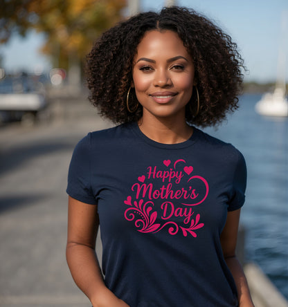 Woman wearing a navy blue t-shirt with 'Happy Mother's Day' in pink text, standing by a waterfront.