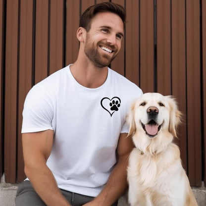 Person wearing a classic white T-shirt featuring a simple black heart outline with a paw print inside on the upper left chest. The minimalist Heart Paw Print design symbolizes love for pets, making it a perfect shirt for dog and cat lovers.
