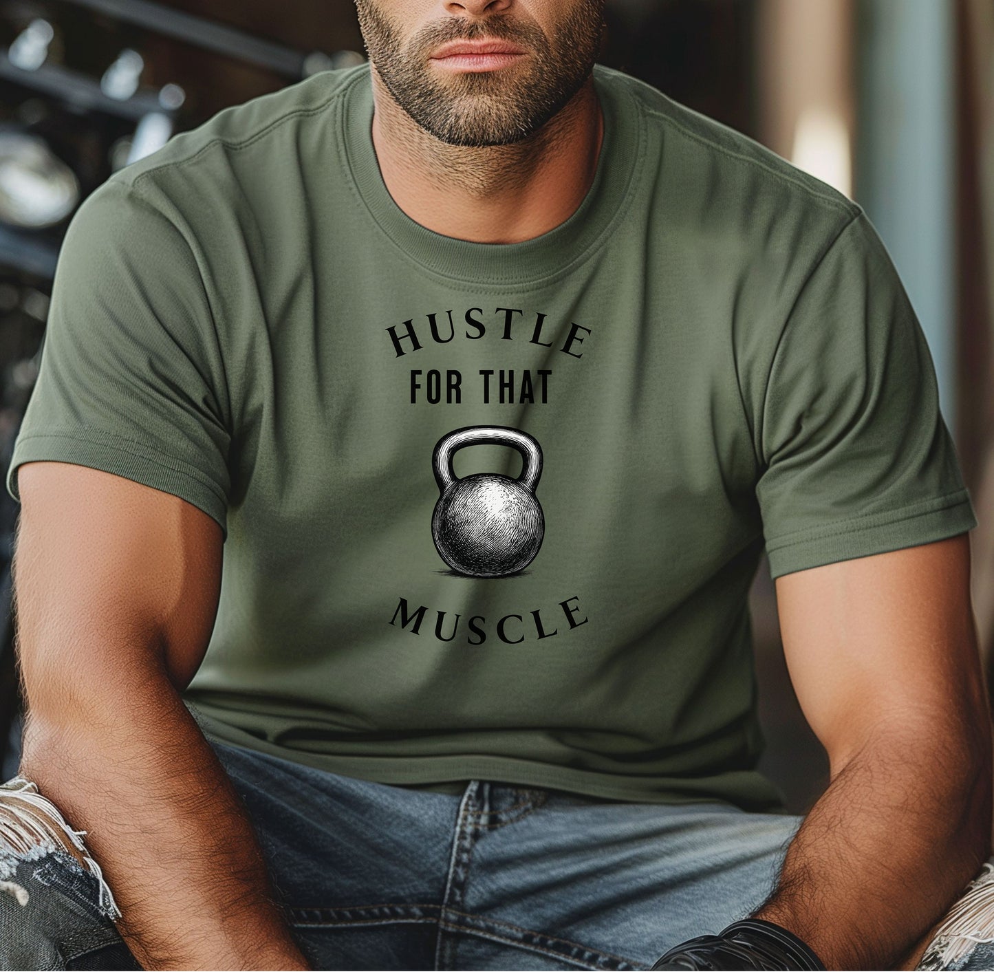 Person wearing a moss T-shirt with the phrase “Hustle For That Muscle” in bold black text, arched above and below a detailed kettlebell graphic. The design blends minimalist style with fitness motivation, perfect for gym-goers, weightlifters, and strength training enthusiasts who embrace hard work and dedication in their workout journey.