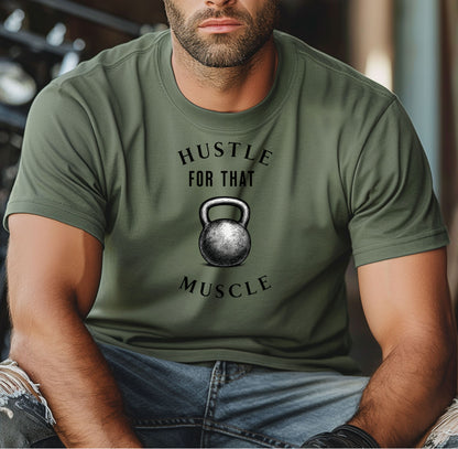 Person wearing a moss T-shirt with the phrase “Hustle For That Muscle” in bold black text, arched above and below a detailed kettlebell graphic. The design blends minimalist style with fitness motivation, perfect for gym-goers, weightlifters, and strength training enthusiasts who embrace hard work and dedication in their workout journey.