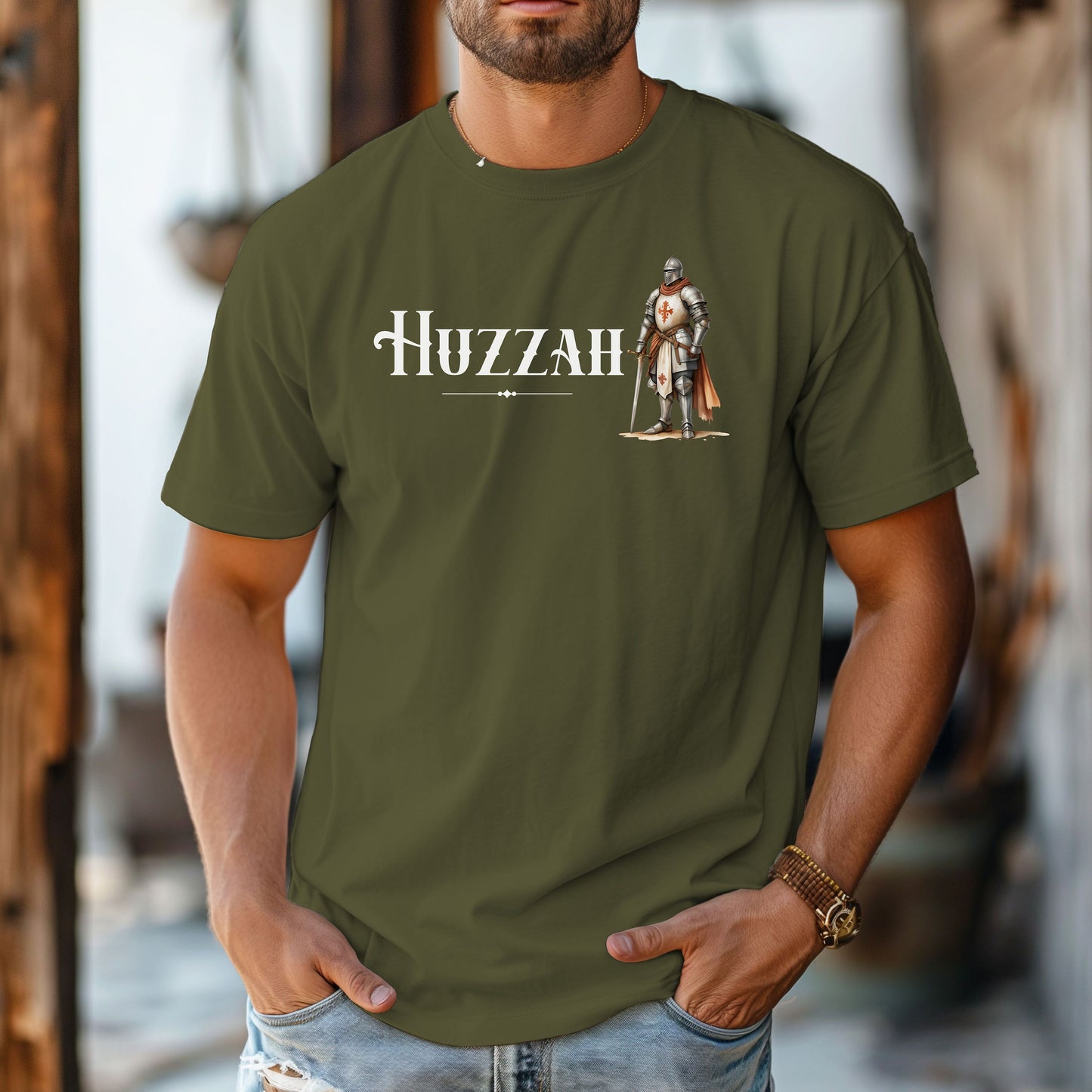 Hemp T-shirt featuring a Renaissance Faire design with the word “Huzzah” in medieval-style lettering and an illustration of a knight in shining armor. Perfect for Renaissance fair goers, medieval enthusiasts, and fans of historical festivals, celebrating the lively and spirited call of “Huzzah” at fairs and events.
