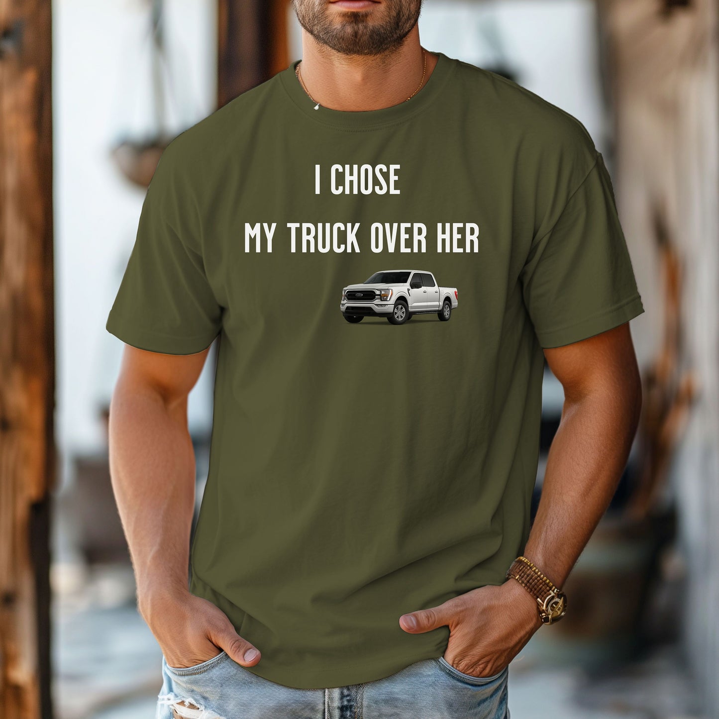 Hemp color T-shirt featuring the bold black text "I Chose My Truck Over Her" with a graphic of a white pickup truck beneath the words. The design has a humorous, confident tone, appealing to truck lovers and automotive enthusiasts. 