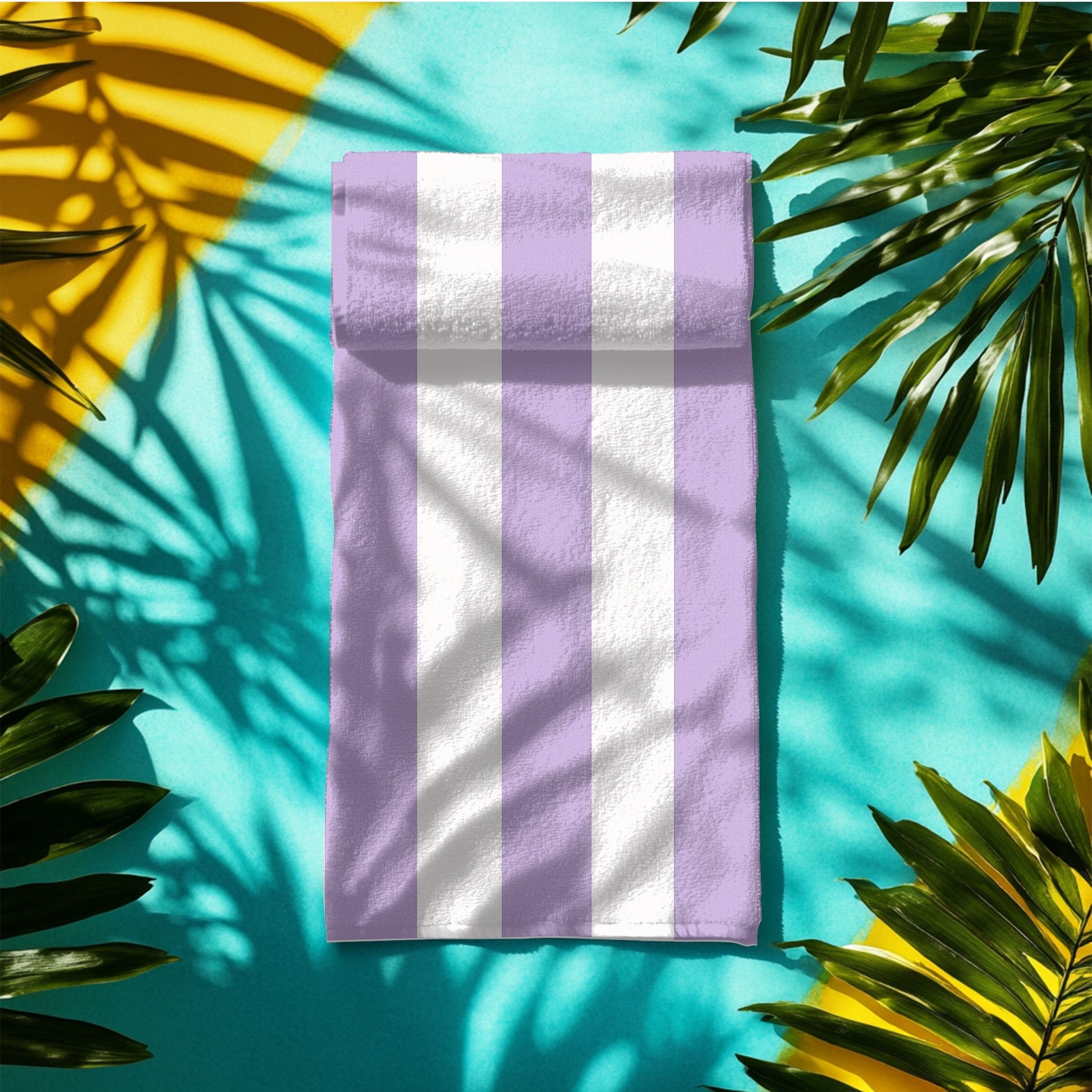 A beach towel with bold vertical lavender and white stripes, folding into a mat on the ground.  The fresh, classic striped design brings a soft and stylish touch to any seaside escape, perfect for lounging, drying off, or making a beachside statement.