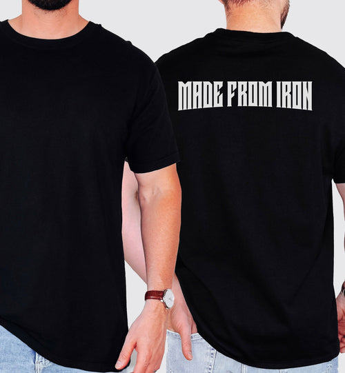 Person wearing a black T-shirt with a bold back design that reads “Made From Iron” in strong, white block lettering. The graphic captures a powerful, fitness-inspired aesthetic, perfect for gym enthusiasts, weightlifters, and strength training fans who want to showcase their dedication and passion for lifting.