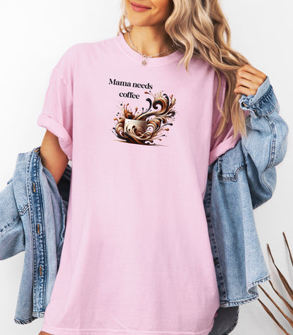 Artistic Blossom pink t-shirt design featuring a white coffee cup surrounded by dynamic swirls of coffee, cream, and espresso in rich browns and blacks. Bold and expressive "Mama needs coffee" text this design captures the energy and chaos of caffeine cravings—perfect for moms who run on coffee and need a stylish way to show it.