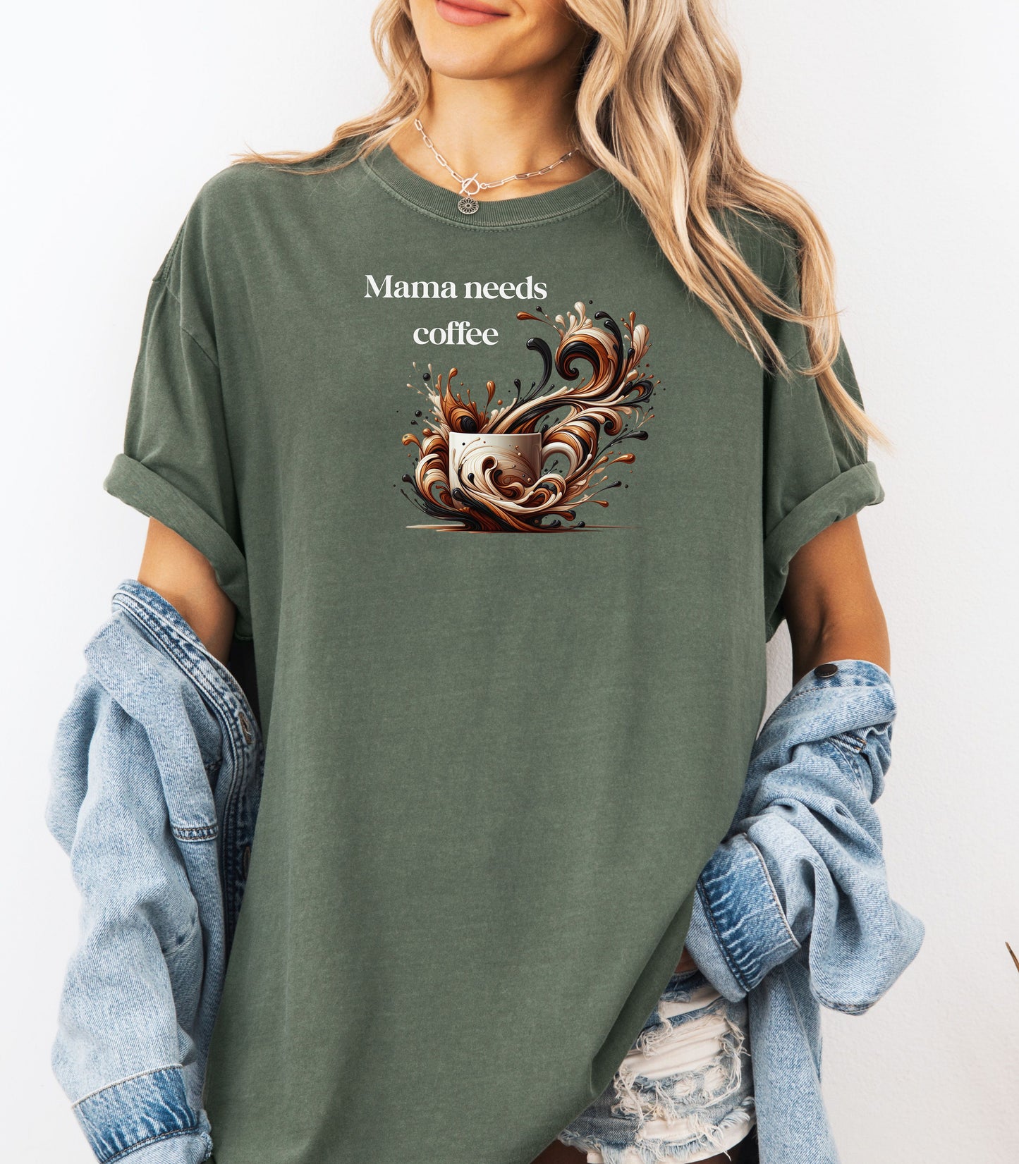 Artistic Hemp color t-shirt design featuring a white coffee cup surrounded by dynamic swirls of coffee, cream, and espresso in rich browns and blacks. Bold and expressive "Mama needs coffee" text this design captures the energy and chaos of caffeine cravings—perfect for moms who run on coffee and need a stylish way to show it.