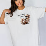 Artistic white t-shirt design featuring a white coffee cup surrounded by dynamic swirls of coffee, cream, and espresso in rich browns and blacks. Bold and expressive, black "Mama needs coffee" text this design captures the energy and chaos of caffeine cravings—perfect for moms who run on coffee and need a stylish way to show it.