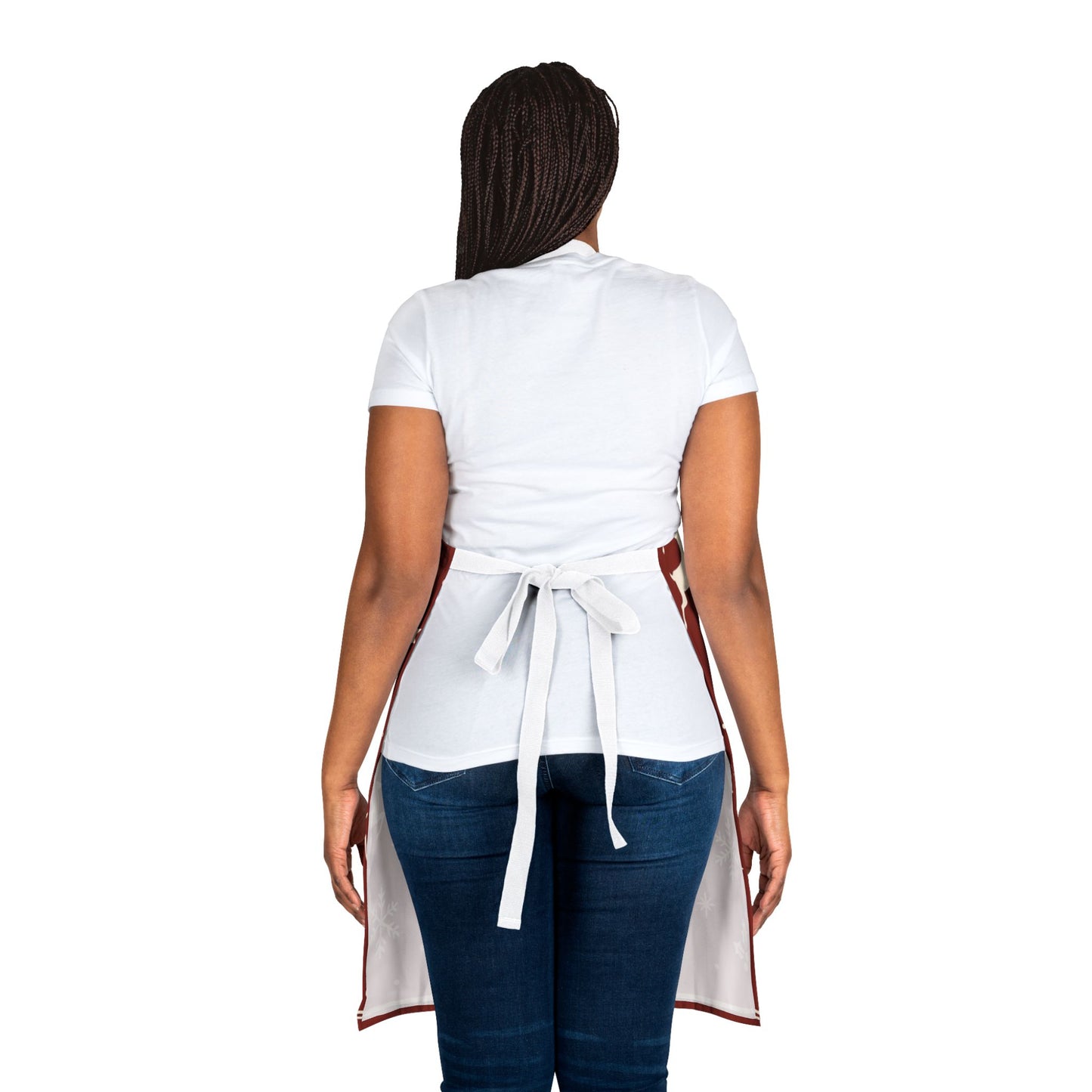 Dark red Christmas apron with white snowflakes, trees, reindeer, and festive text reading “Merry Christmas,” perfect for holiday baking and cooking.
