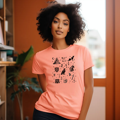 Person wearing a Sunset T-shirt featuring the "Moonlit Magick" Renaissance Faire design. The shirt showcases a collection of detailed black illustrations, including a medieval castle, a dragon, knight helmet, shield, raven, spellbook, sword, key, mug of ale, and stars—capturing the enchanting spirit of medieval fantasy.