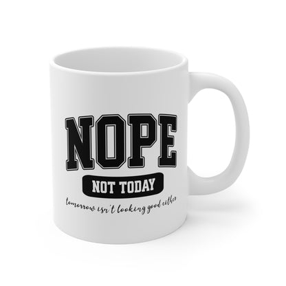 White ceramic mug with bold black collegiate text that reads “NOPE” and “NOT TODAY, tomorrow isn't looking good either” a humorous minimalist design for anyone in a not-today mood.