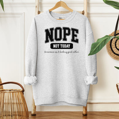An Ash sweatshirt with bold white text reading “NOPE NOT TODAY” and smaller script “tomorrow isn’t looking good either,” a humorous casual design for lazy days.
