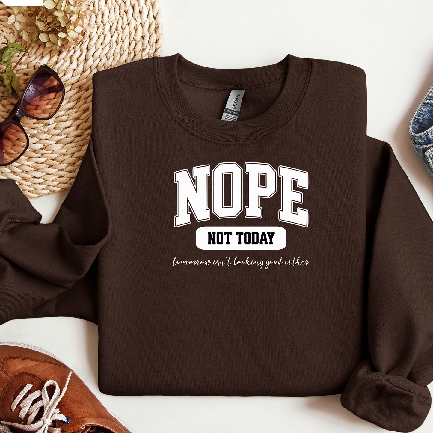 An Espresso  sweatshirt with bold white text reading “NOPE NOT TODAY” and smaller script “tomorrow isn’t looking good either,” a humorous casual design for lazy days.
