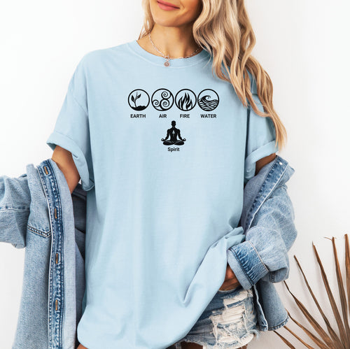 Chambray light blue t-shirt featuring a minimalist Nature’s Elements design with black icons representing Earth, Air, Fire, and Water in circular symbols, with a meditating figure below symbolizing Spirit. Perfect for yoga, meditation, mindfulness, balance, and nature lovers. Relaxed fit, casual boho style.