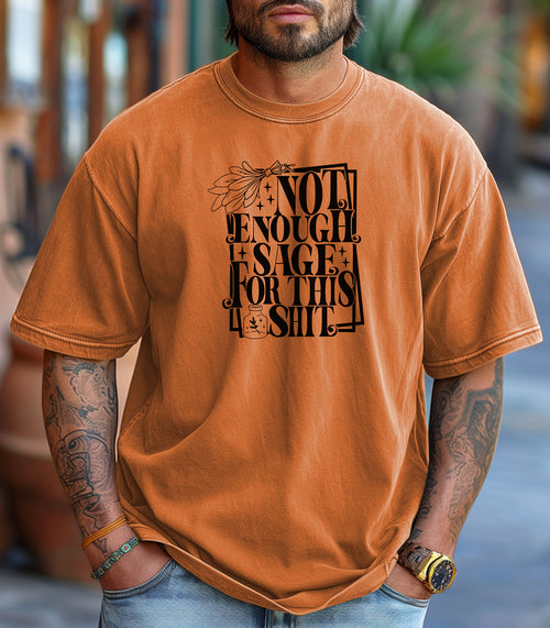 Yam T-shirt with bold black typography reading “Not Enough Sage For This Shit,” accented with illustrated sage leaves, sparkles, and a small potion jar with a leafy design. Playful and cheeky statement shirt for spiritual, witchy, or humor-loving personalities.