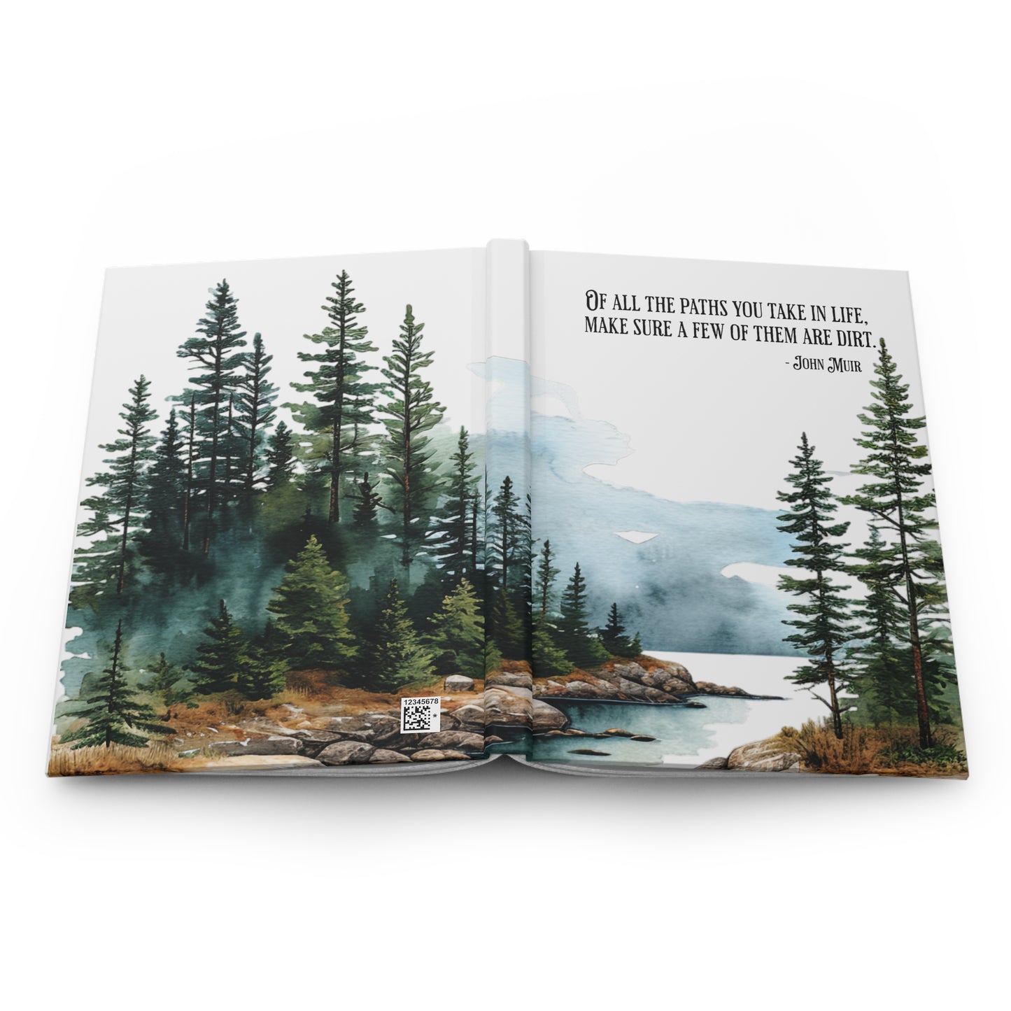 Open hardcover journal with nature-themed cover featuring trees and a lake, showing the front and back