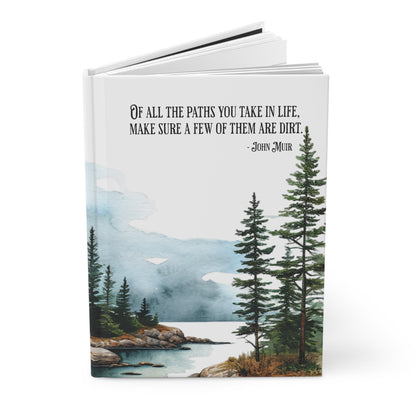 Hardcover journal with nature-themed cover and John Muir quote on a white background