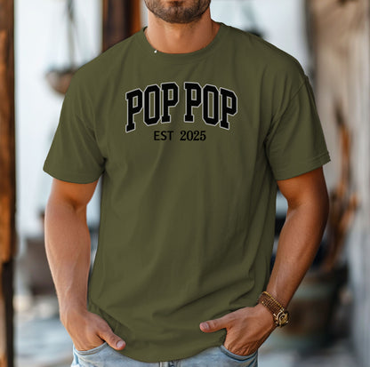 POP POP Est [Year] T-shirt featuring bold varsity-style lettering with a customizable establishment year. Displayed on a soft, Hemp color unisex tee, this casual design is perfect for celebrating a new grandfather or marking a special year. Ideal for Father’s Day, birthdays, or family gatherings, it combines comfort with a proud, personalized statement.