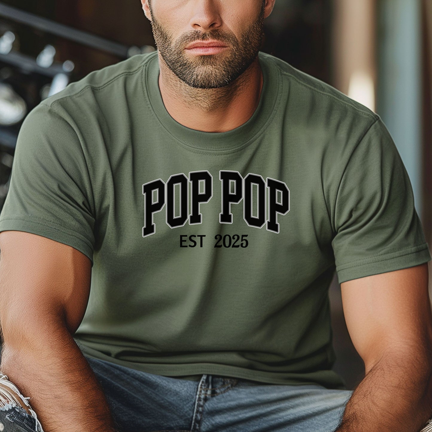 POP POP Est [Year] T-shirt featuring bold varsity-style lettering with a customizable establishment year. Displayed on a soft, moss unisex tee, this casual design is perfect for celebrating a new grandfather or marking a special year. Ideal for Father’s Day, birthdays, or family gatherings, it combines comfort with a proud, personalized statement.