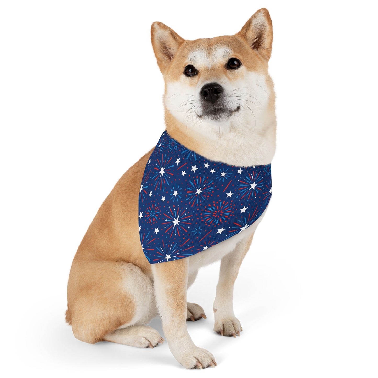 Dog wearing a blue Patriotic Firework bandana with star and stripe pattern on a white background