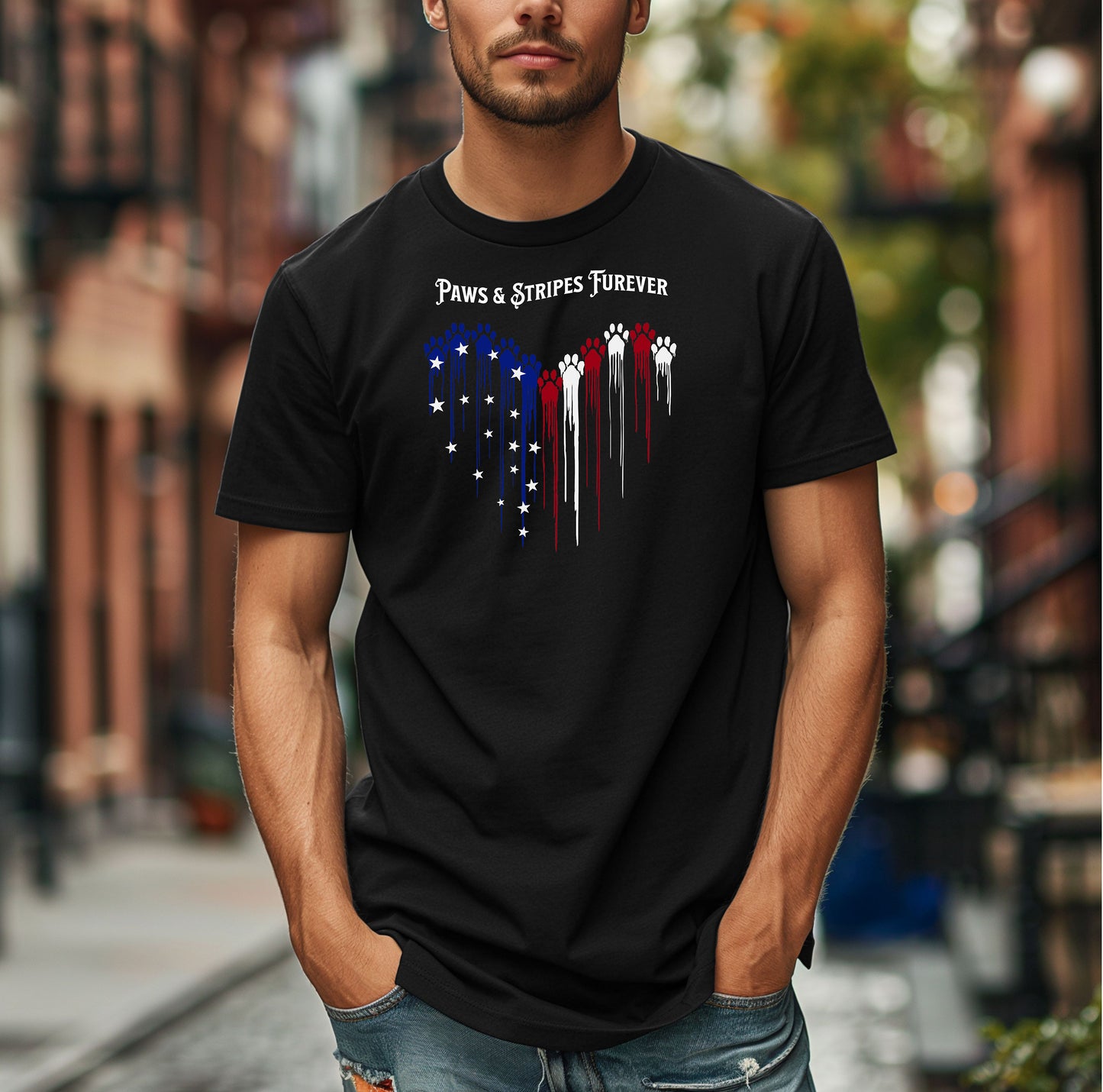 Person wearing a black T-shirt featuring a heart-shaped design made of dripping red, white, and blue paw prints with star accents. Above the heart, the text reads “Paws & Stripes Furever,” blending patriotic pride with a love for pets, making it a perfect shirt for animal lovers and USA enthusiasts.
