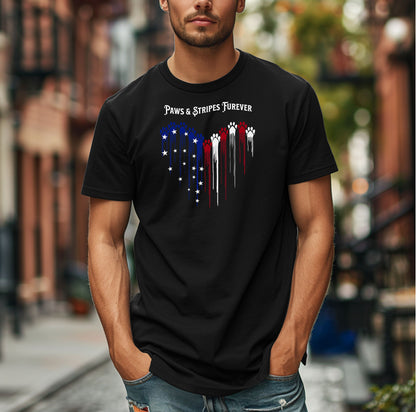 Person wearing a black T-shirt featuring a heart-shaped design made of dripping red, white, and blue paw prints with star accents. Above the heart, the text reads “Paws & Stripes Furever,” blending patriotic pride with a love for pets, making it a perfect shirt for animal lovers and USA enthusiasts.