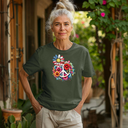 Hemp color t-shirt featuring a vibrant retro Peace Love Liberty design with a large white peace sign surrounded by colorful flowers. A daisy with red, white, and blue American flag petals stands out, blending patriotic style with boho hippie vibes. Perfect for 4th of July, festivals, and casual summer wear.