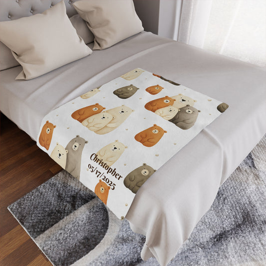Personalized minky blanket with bear family pattern and personalized text on a bed