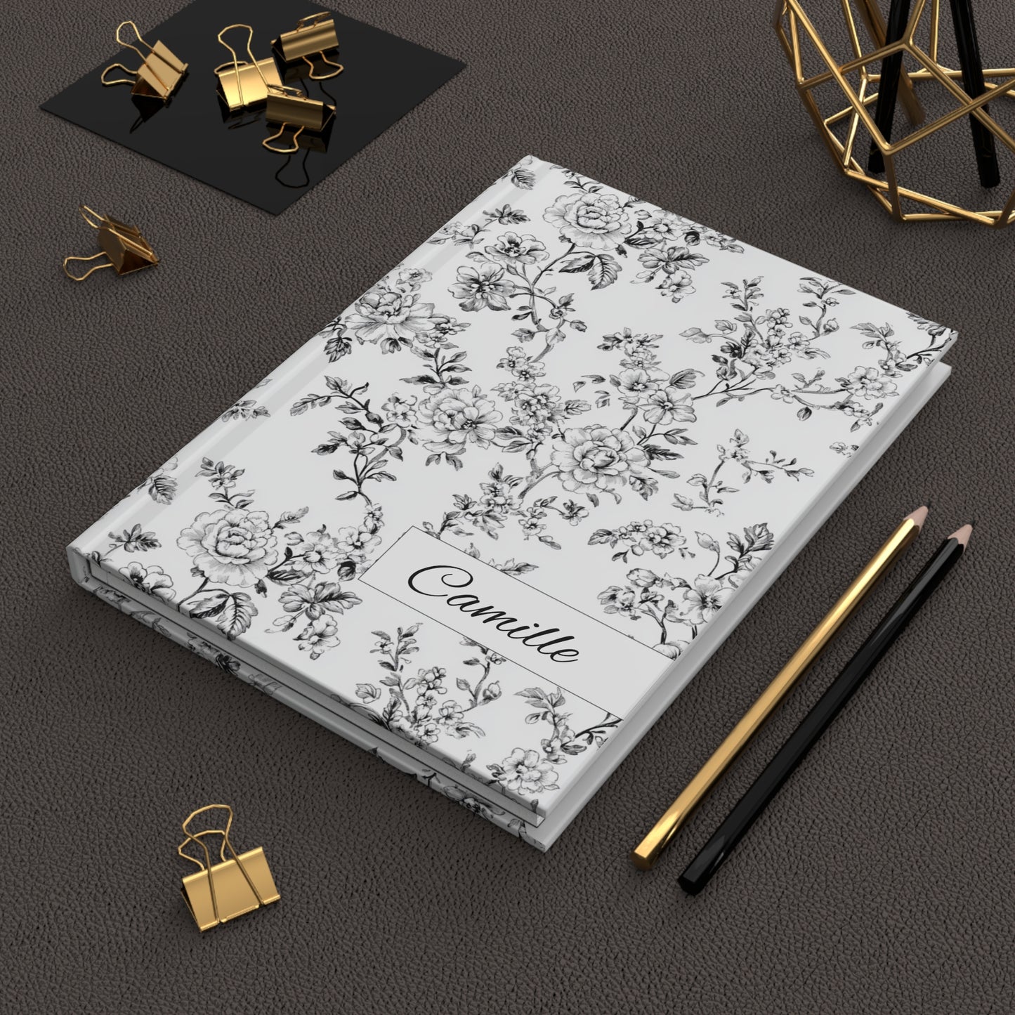 Personalized black toile floral hardcover journal in an office setting