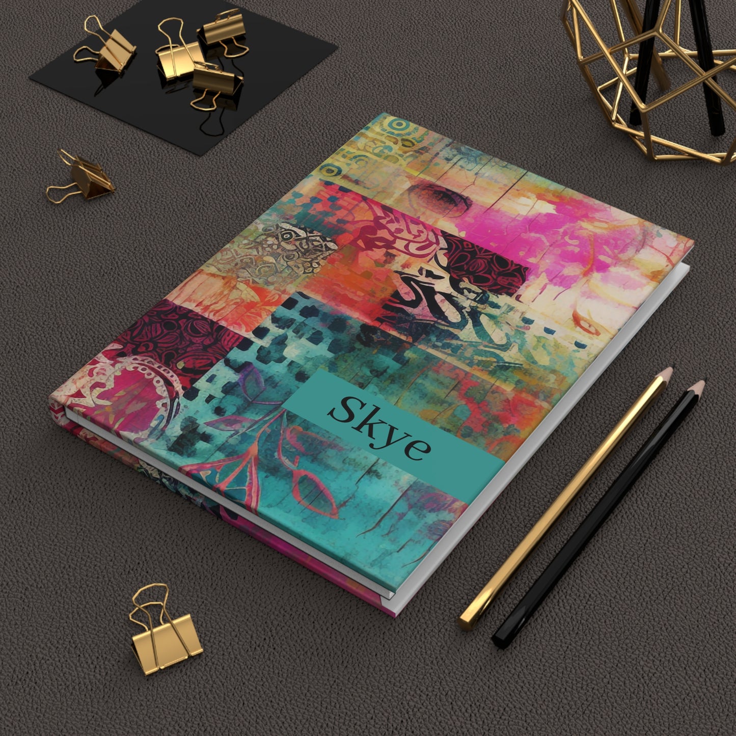 Personalized Boho Hardcover Journal with name text on a dark surface with office supplies.