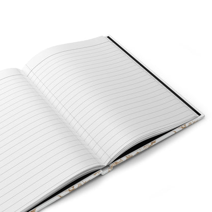 Open journal with lined pages on a white background