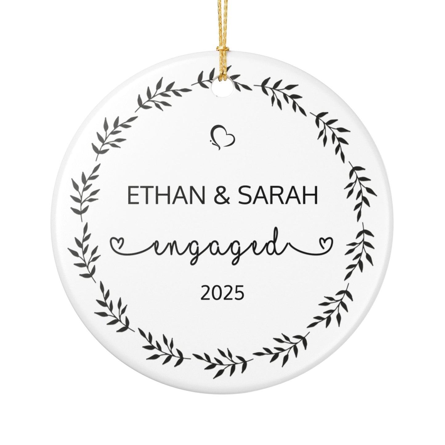 Personalized engagement ornament with name and year hanging from gold cord