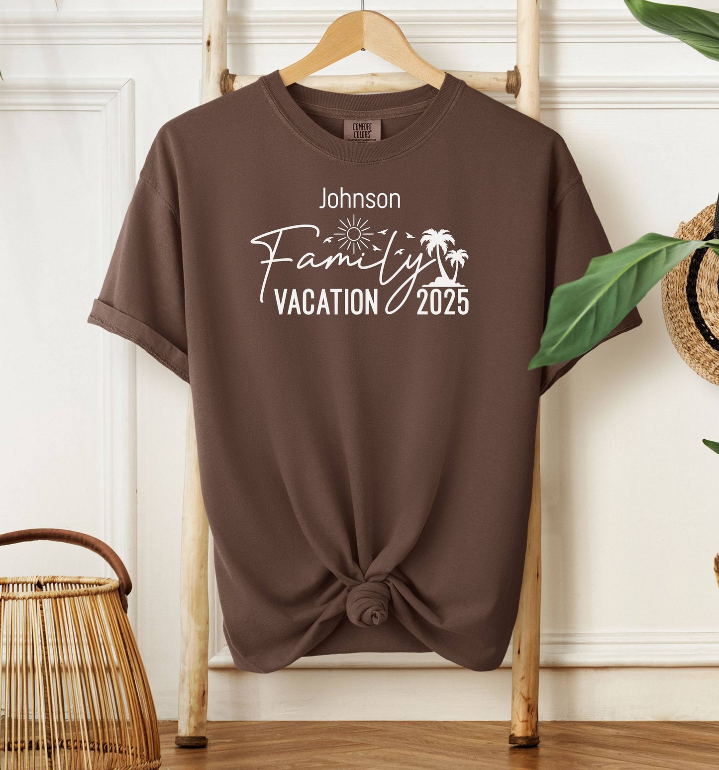 Espresso T-shirt with a customizable “Family Vacation 2025” design featuring a sun, palm trees, and modern script font. Personalized with a family name, this shirt is perfect for coordinating outfits on summer vacations, reunions, or beach trips, creating a fun and memorable matching look for the whole group.
