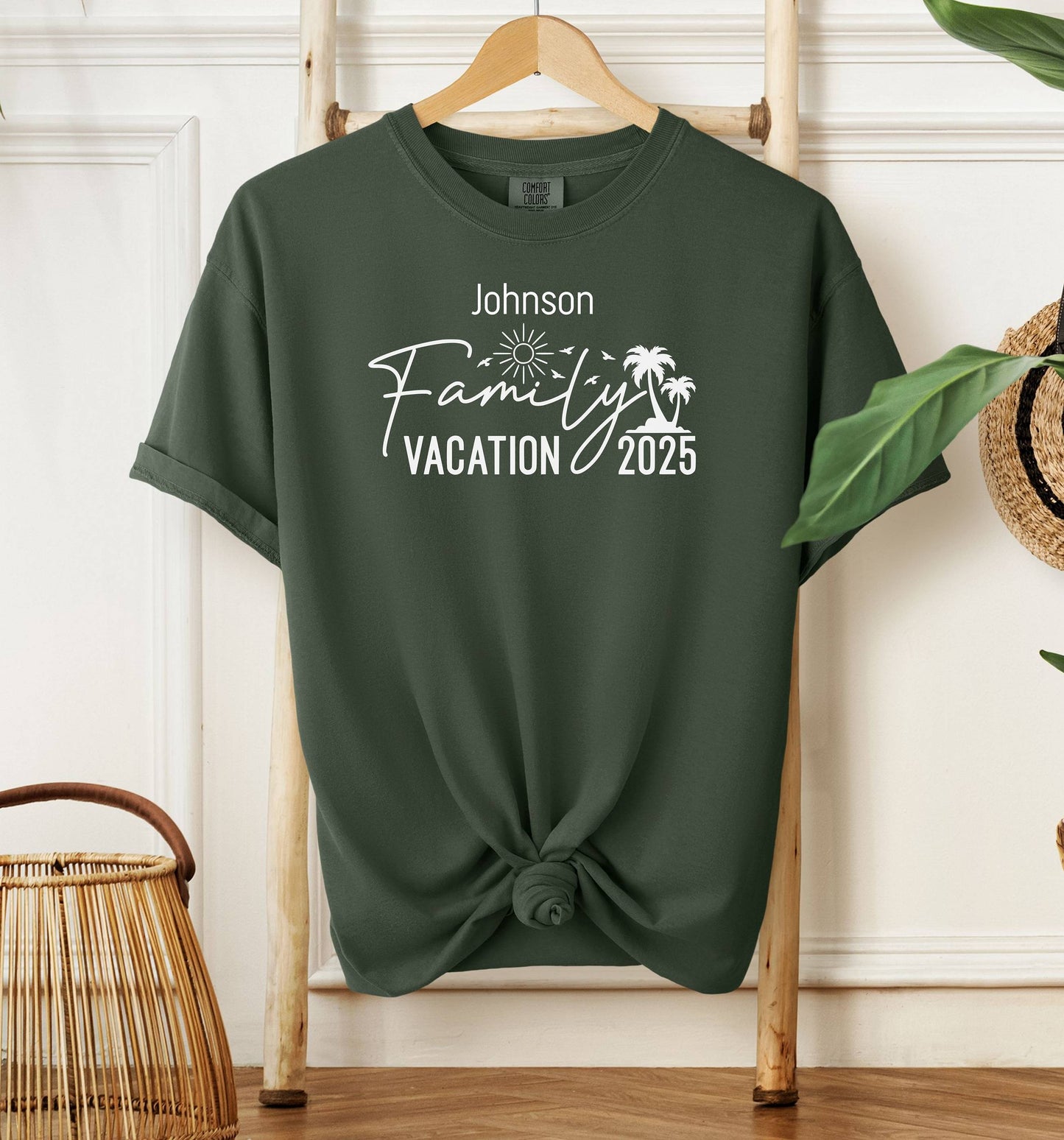 Hemp color T-shirt with a customizable “Family Vacation 2025” design featuring a sun, palm trees, and modern script font. Personalized with a family name, this shirt is perfect for coordinating outfits on summer vacations, reunions, or beach trips, creating a fun and memorable matching look for the whole group.