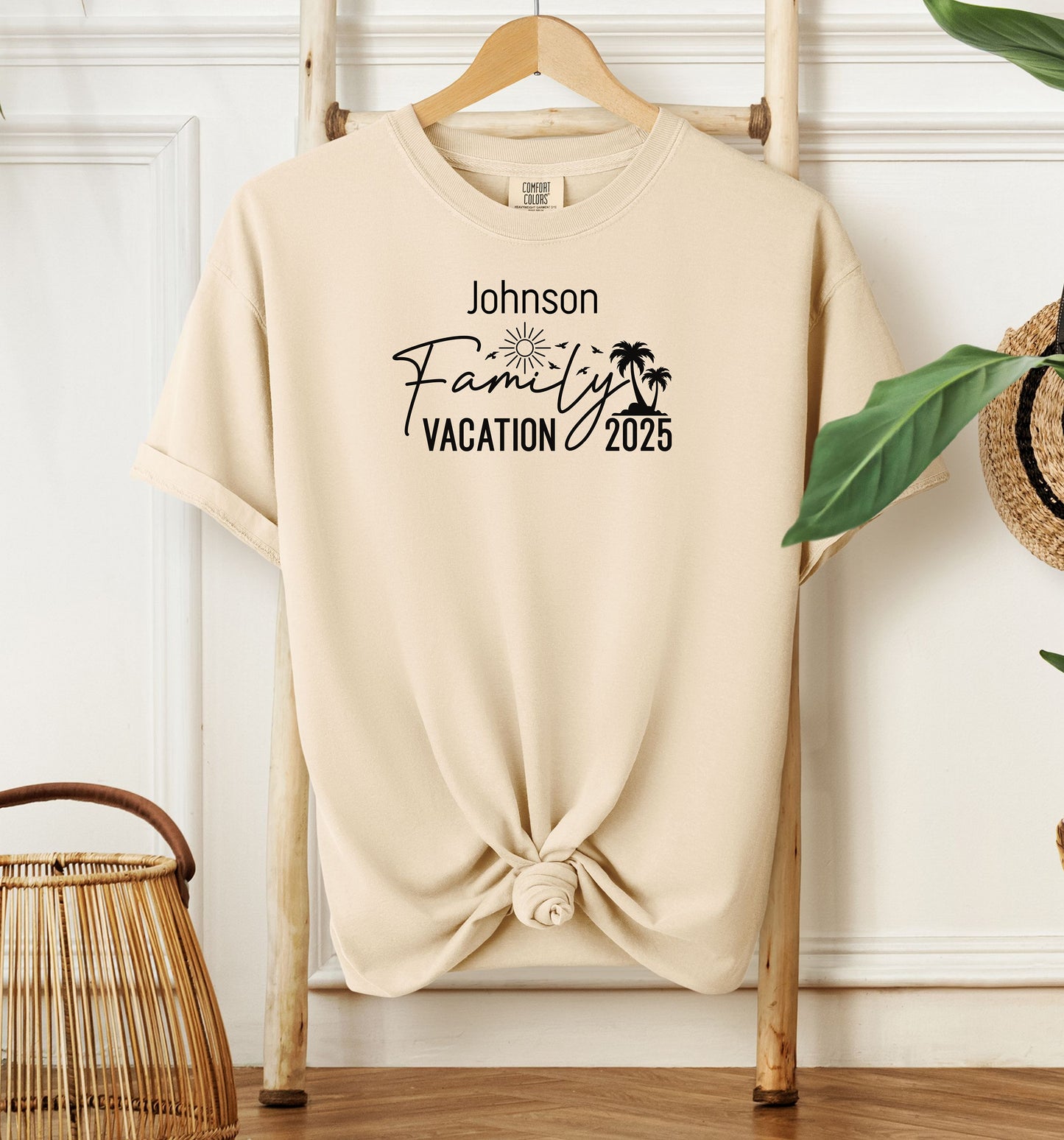 Ivory T-shirt with a customizable “Family Vacation 2025” design featuring a sun, palm trees, and modern script font. Personalized with a family name, this shirt is perfect for coordinating outfits on summer vacations, reunions, or beach trips, creating a fun and memorable matching look for the whole group.