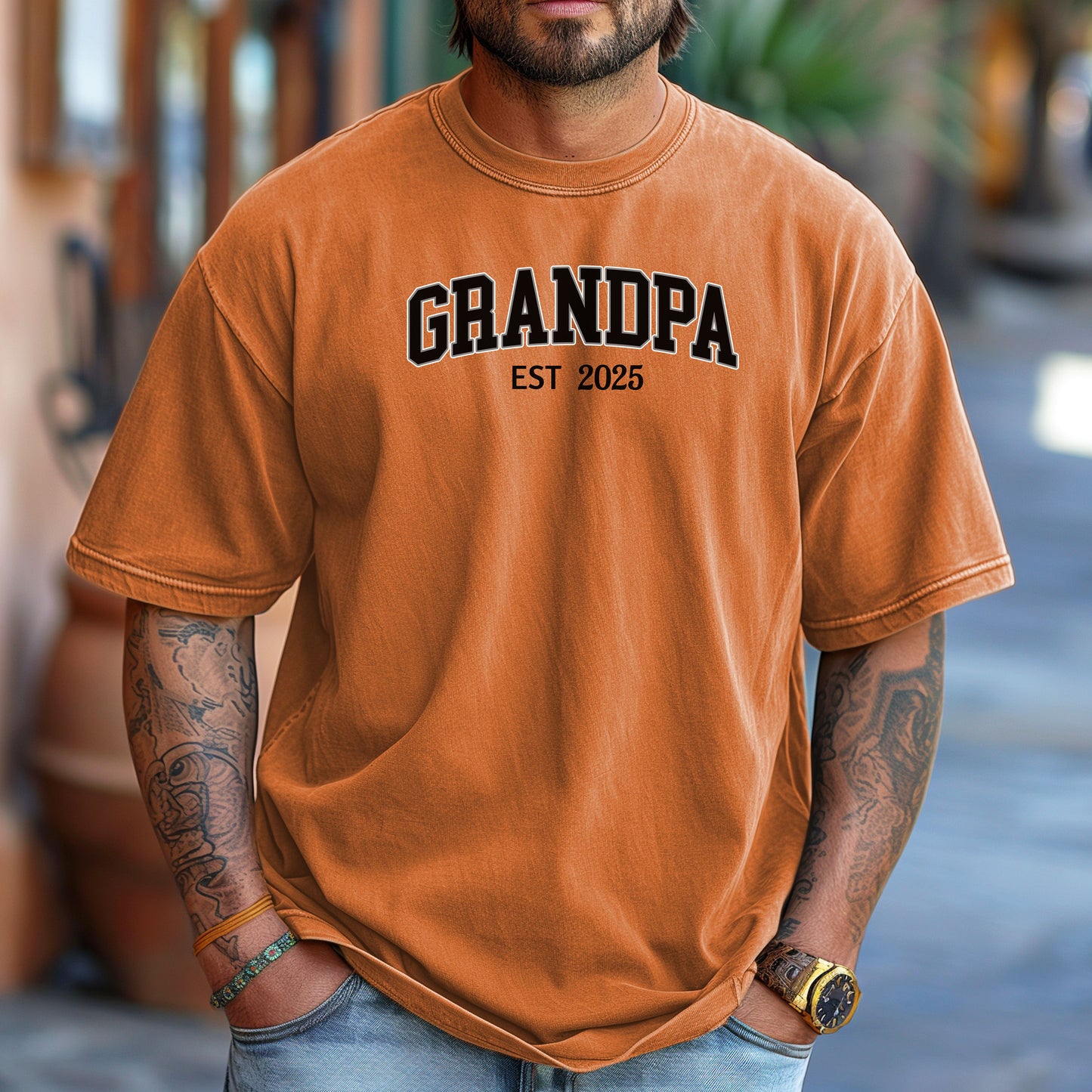 Yam t-shirt featuring a bold collegiate-style 'GRANDPA EST [Year]' design in black and white lettering. Perfect gift for new grandfathers to celebrate the year they became a grandpa. A thoughtful, casual, and comfortable shirt ideal for Father's Day, family gatherings, or everyday wear.