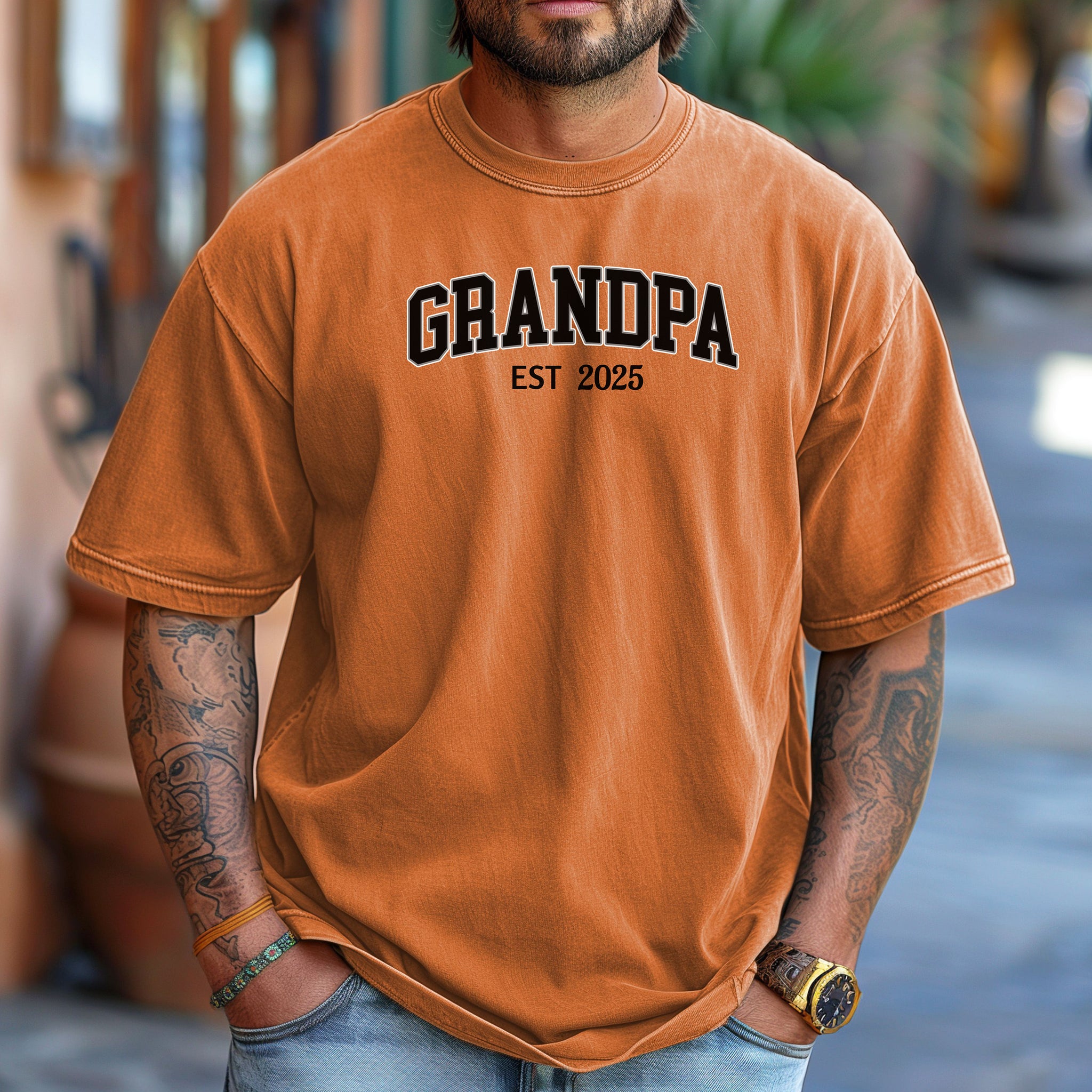 Yam t-shirt featuring a bold collegiate-style 'GRANDPA EST [Year]' design in black and white lettering. Perfect gift for new grandfathers to celebrate the year they became a grandpa. A thoughtful, casual, and comfortable shirt ideal for Father's Day, family gatherings, or everyday wear.