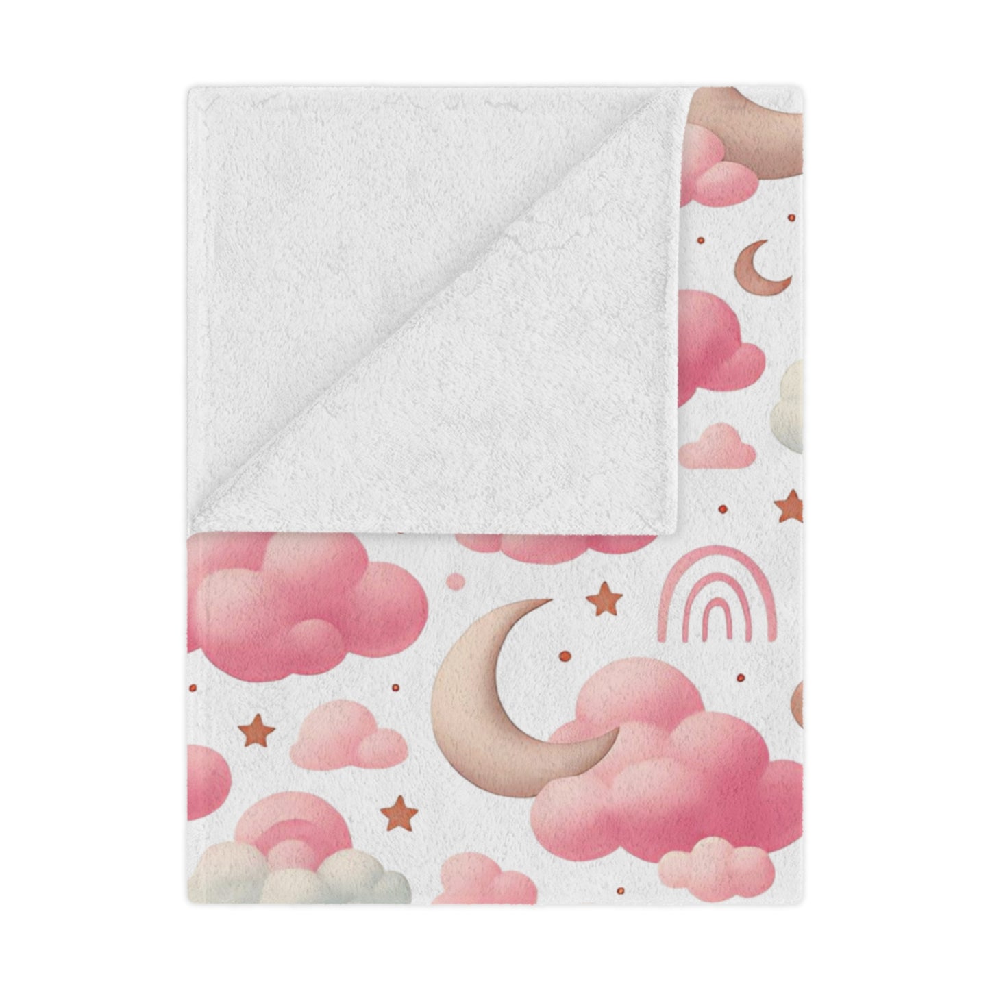 Personalized baby blanket with clouds, stars, and pink rainbow pattern on a bed.