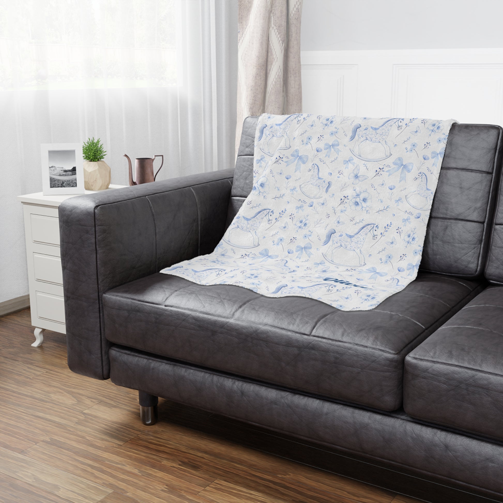 Personalized Rocking Horse Minky blanket with blue chinoiserie patterns and 'Oliver' text on a bed in a bedroom.