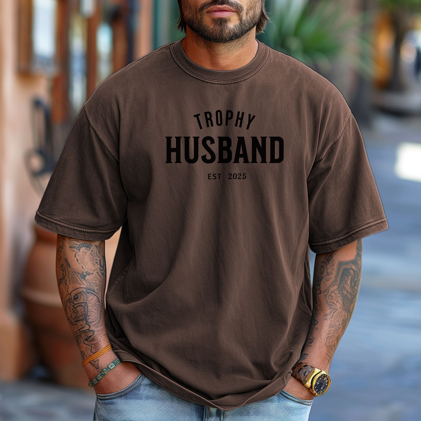Espresso Trophy Husband EST [Year] graphic T-shirt featuring bold black typography on a casual crewneck shirt. Perfect gift for newlyweds, anniversaries, grooms, or husbands with a sense of humor. Comfortable, stylish, and great for everyday wear or special occasions to celebrate marriage and fun couple vibes.