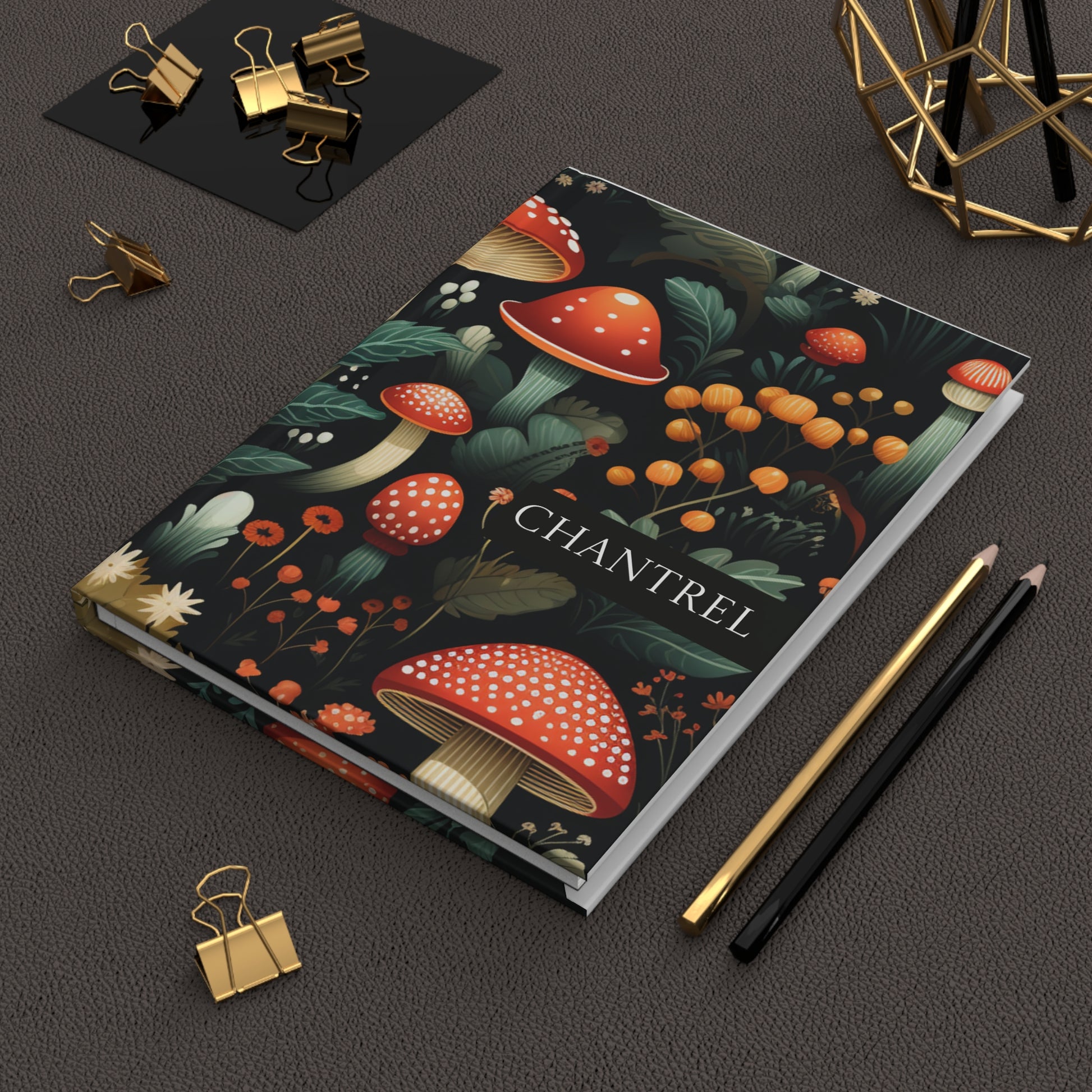 Personalized Hardcover Journal with a mushroom design on a dark surface with stationery items.