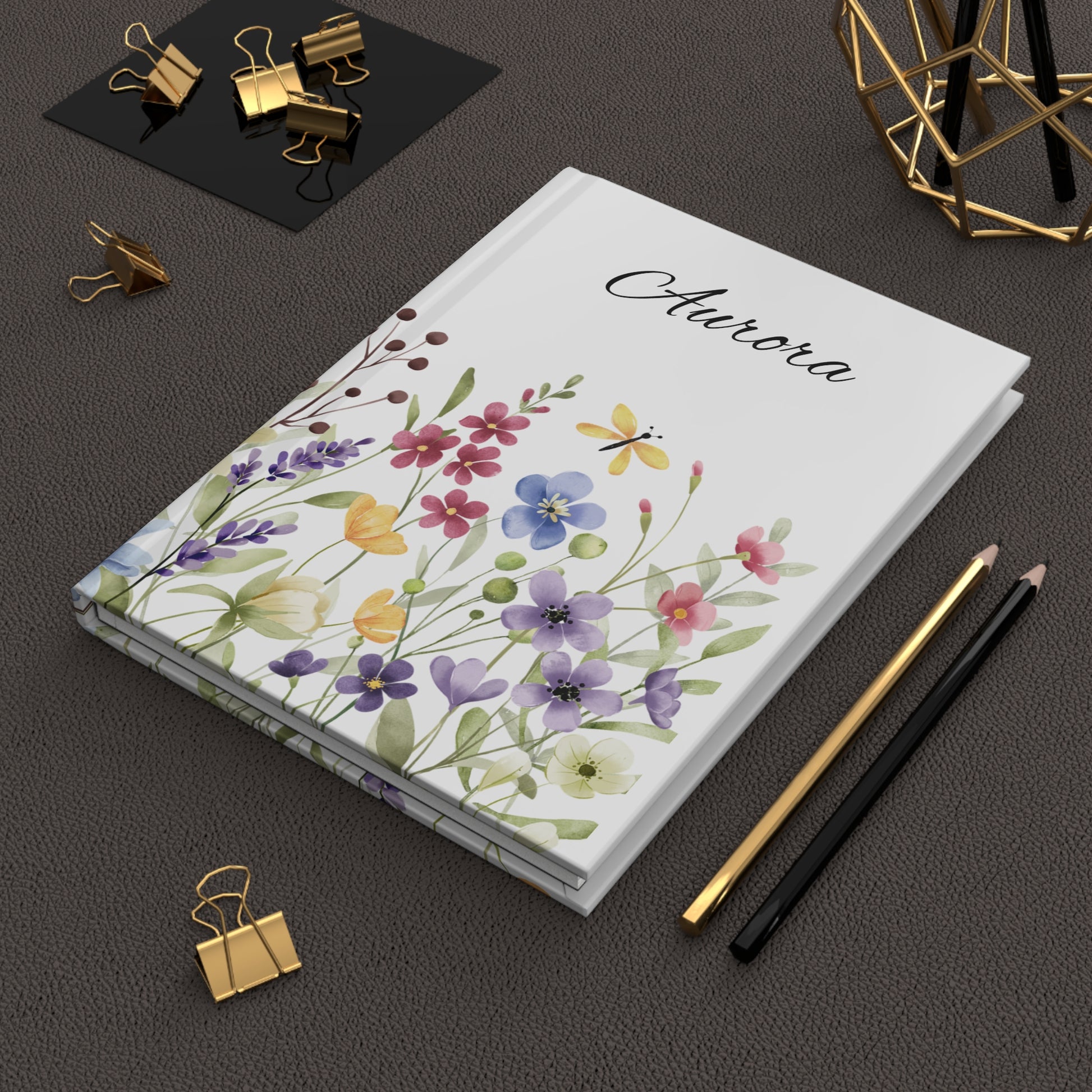 Personalized Wildflower Hardcover Journal with floral design and name sitting in an office setting