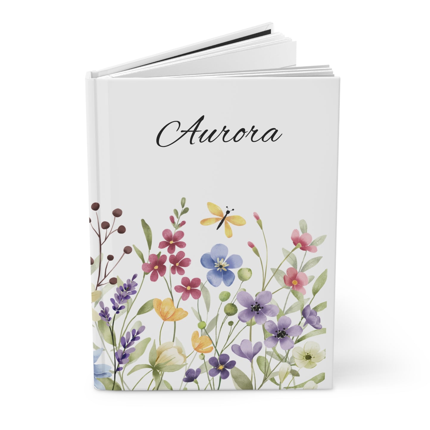 Open journal with floral design and name on a white background