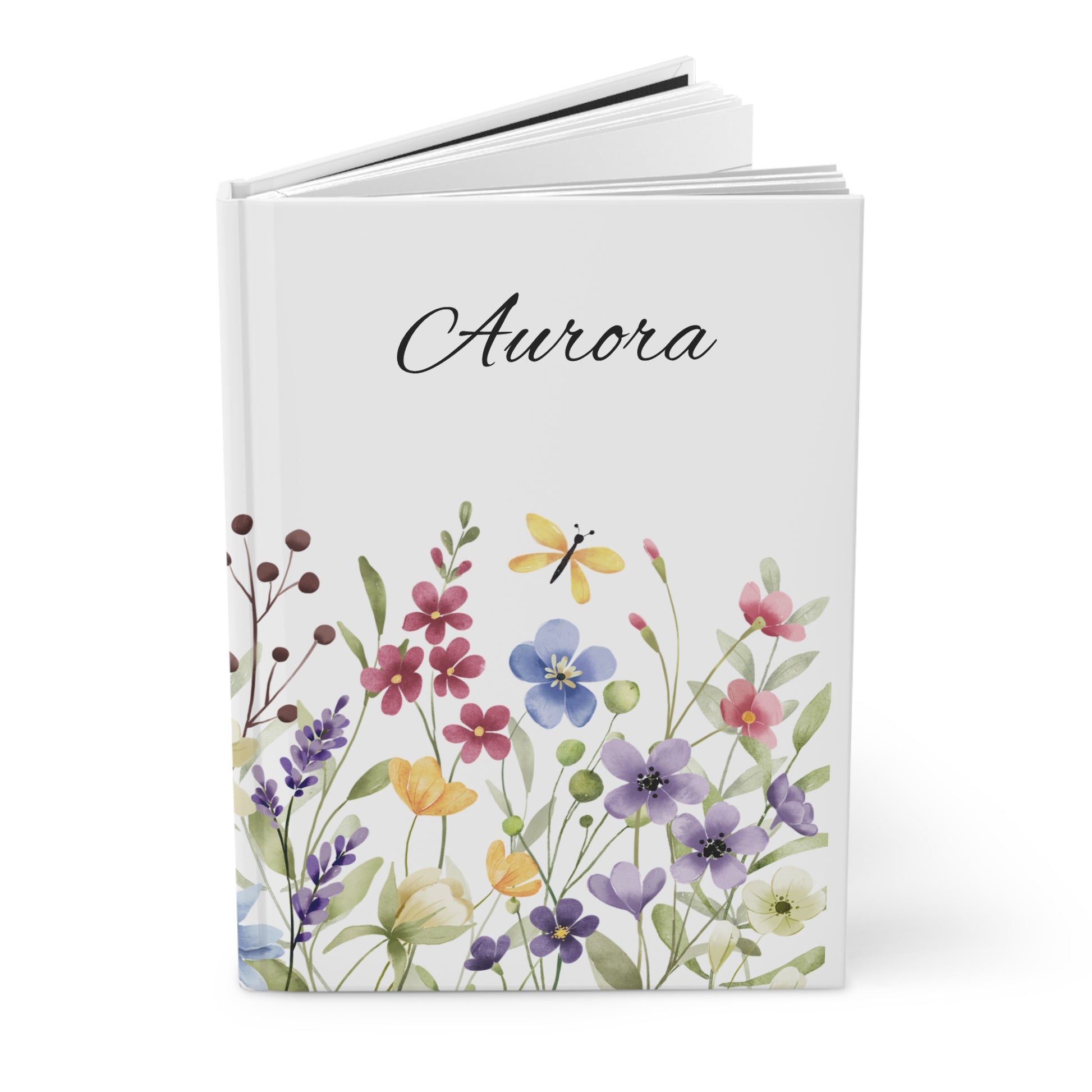 Open journal with floral design and name on a white background