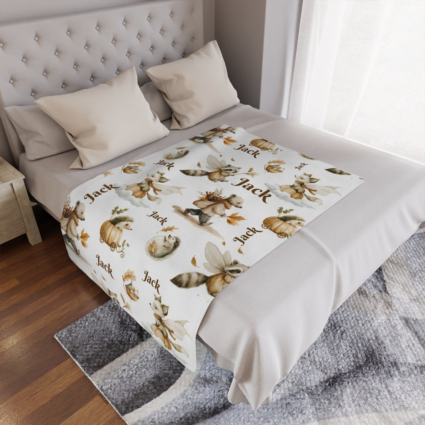 Personalized Woodland Animal Minky Nursery Blanket with 'Jack' name pattern draped over a bed in a bedroom setting