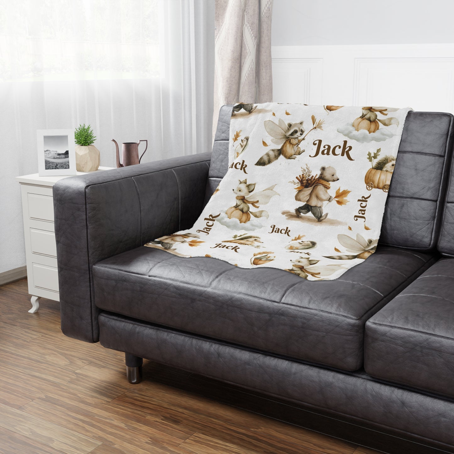 Personalized Woodland Animal Minky Nursery Blanket with 'Jack' name pattern draped over a bed in a bedroom setting