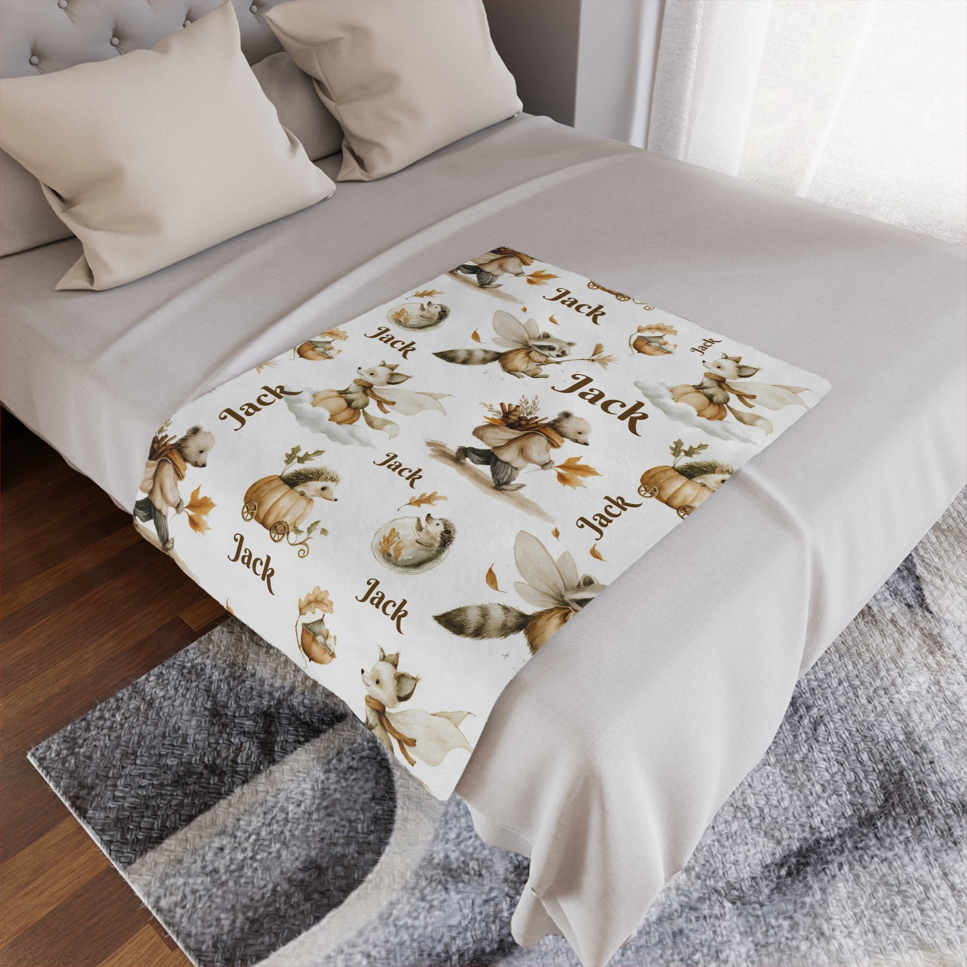 Personalized Woodland Animal Nursery Minky Blanket with 'Jack' name pattern draped over a bed in a bedroom setting