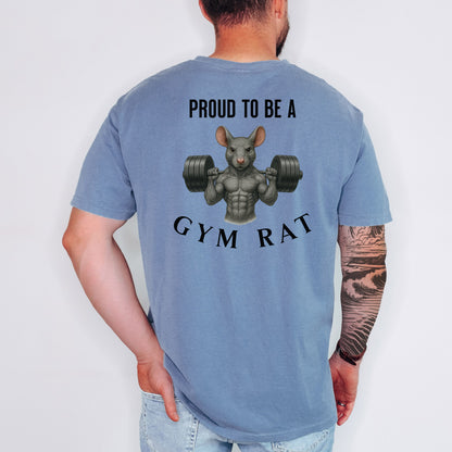 Person wearing a blue jean T-shirt featuring a bold back design with the phrase “Proud to Be a Gym Rat” above and below a muscular cartoon rat holding heavy dumbbells. The strong, flexing rat graphic symbolizes dedication to fitness and weightlifting, making this shirt perfect for gym lovers, bodybuilders, and strength training enthusiasts.